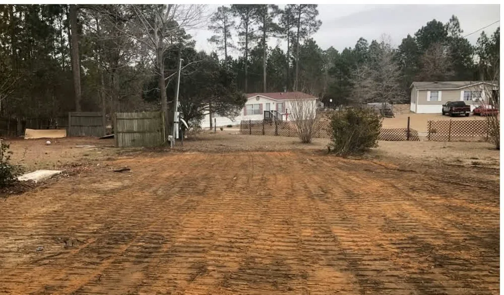 Red clay lot graded smooth after a house was torn down